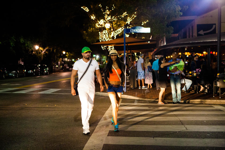 Couple Crossing Street At Night